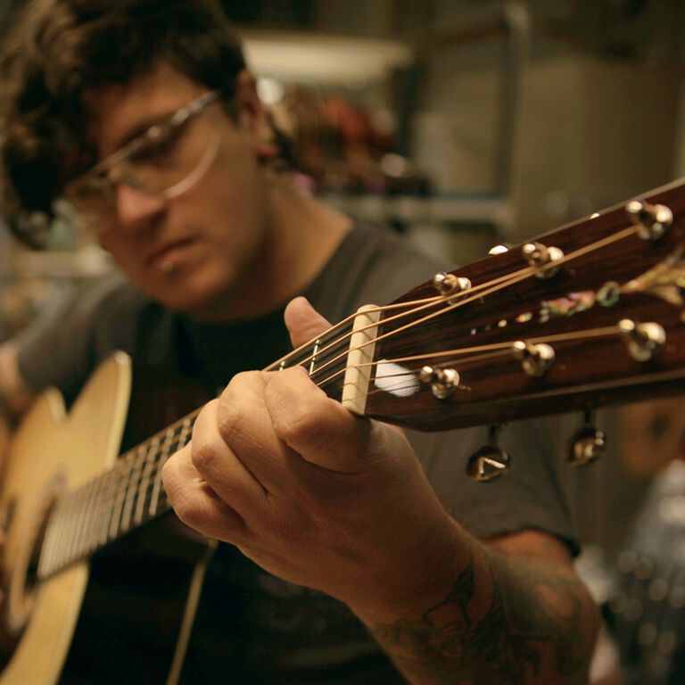 Person playing guitar