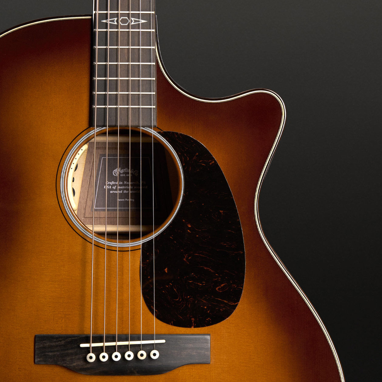 Closeup of a cutaway acoustic guitar