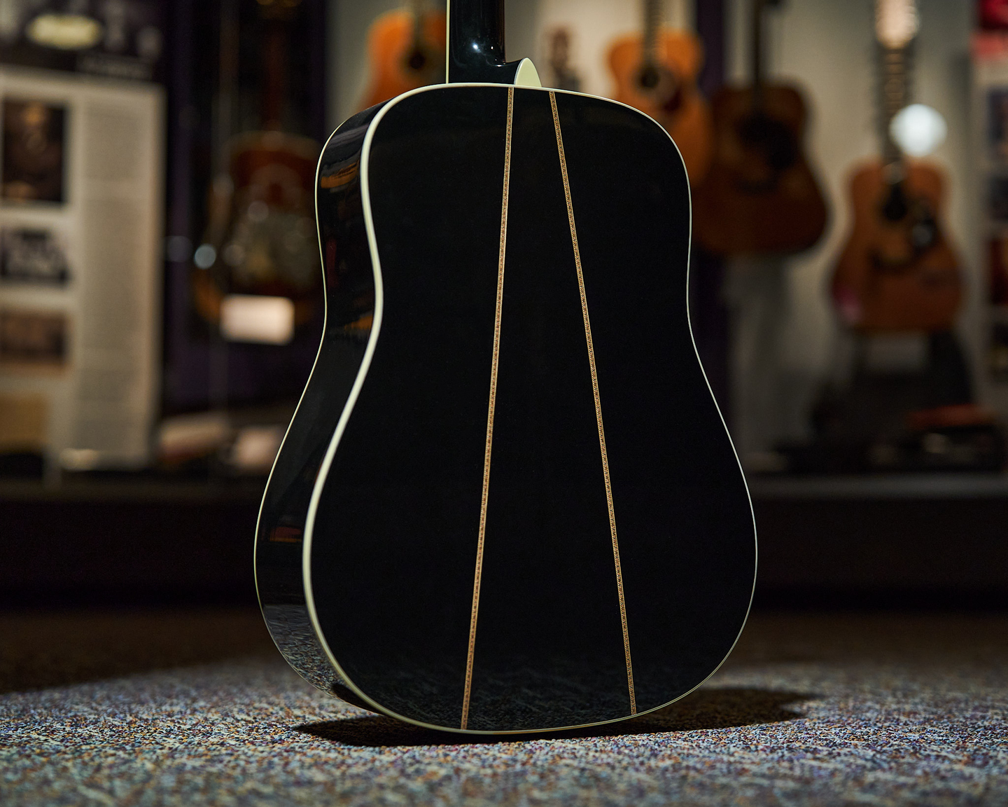 Photo of the back of an acoustic guitar