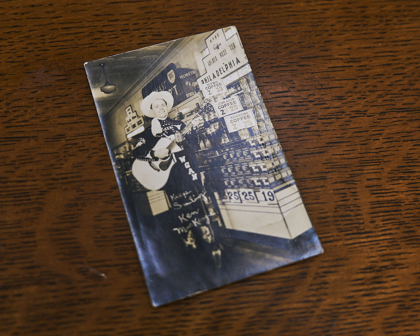 Country singer Ken MacKenzie with his 1939 Martin D-45, proudly personalized with his name inlaid in the fingerboard—captured here on a vintage promotional postcard.