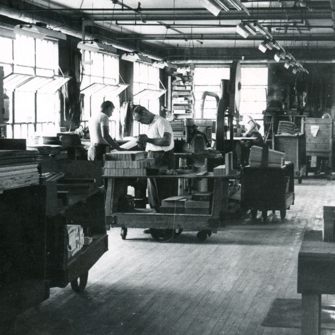 Vintage photo of people working in a factory Vintage photo of people working in a factory