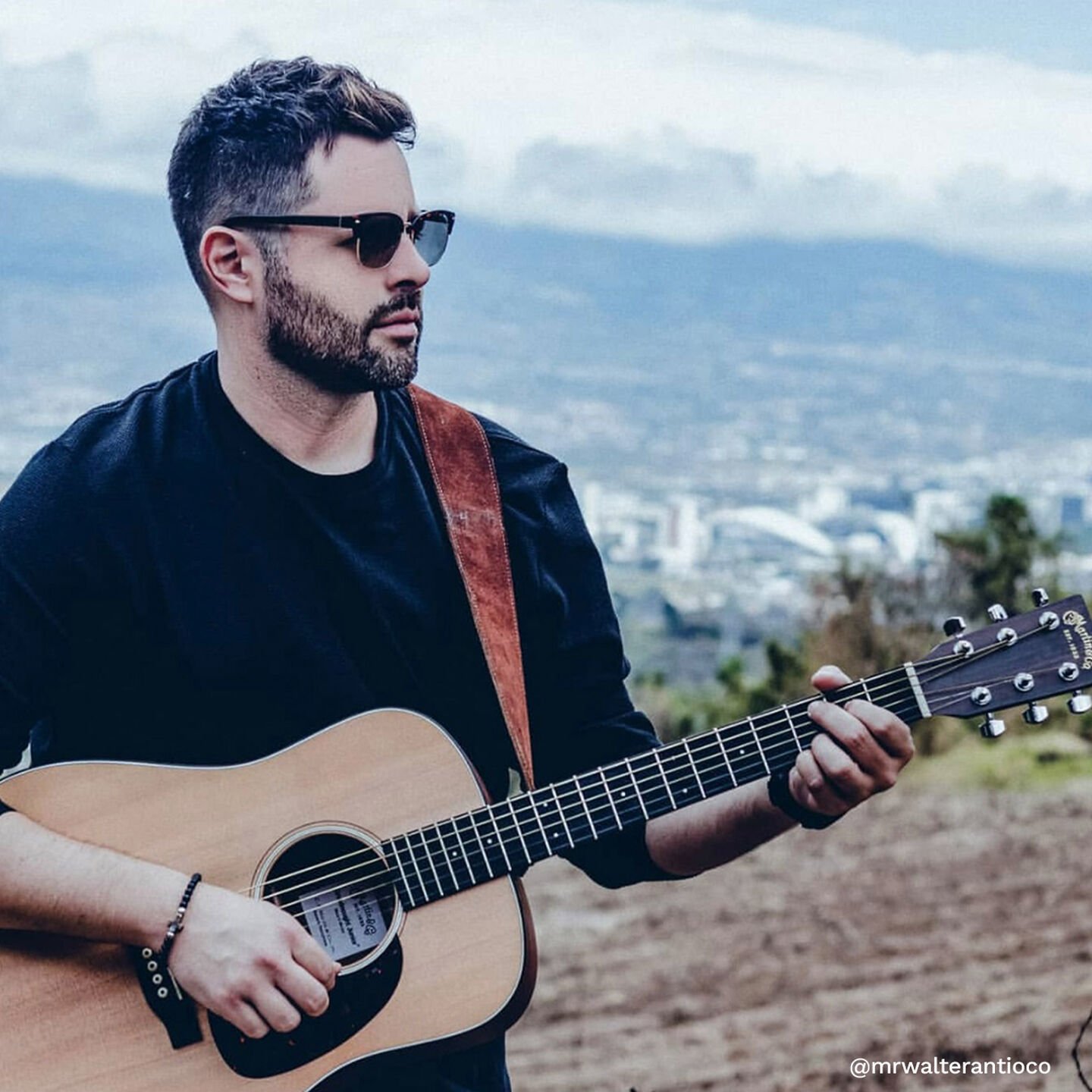 Man playing guitar outdoors