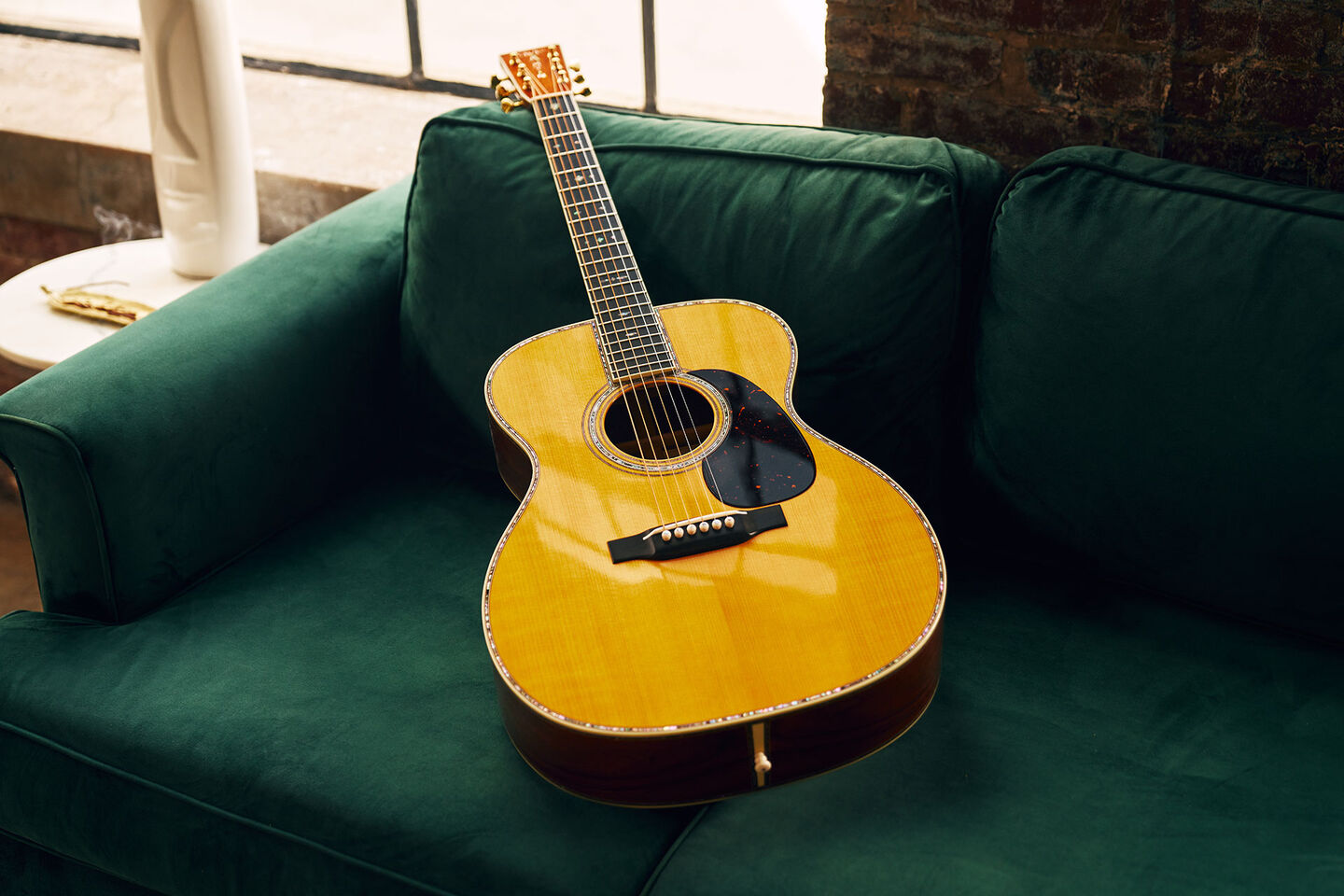 Acoustic guitar on a couch