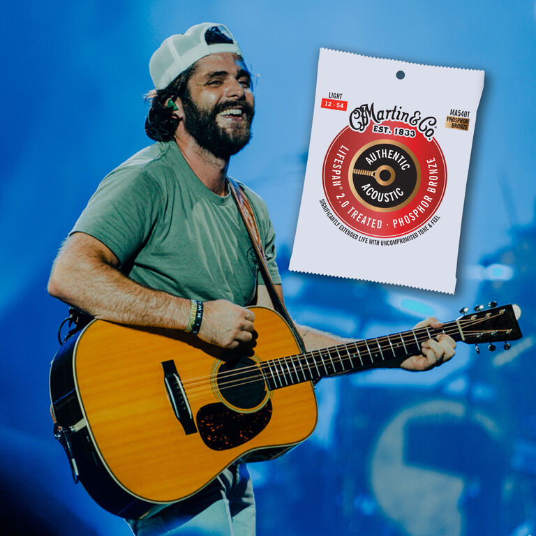 Thomas Rhett playing guitar