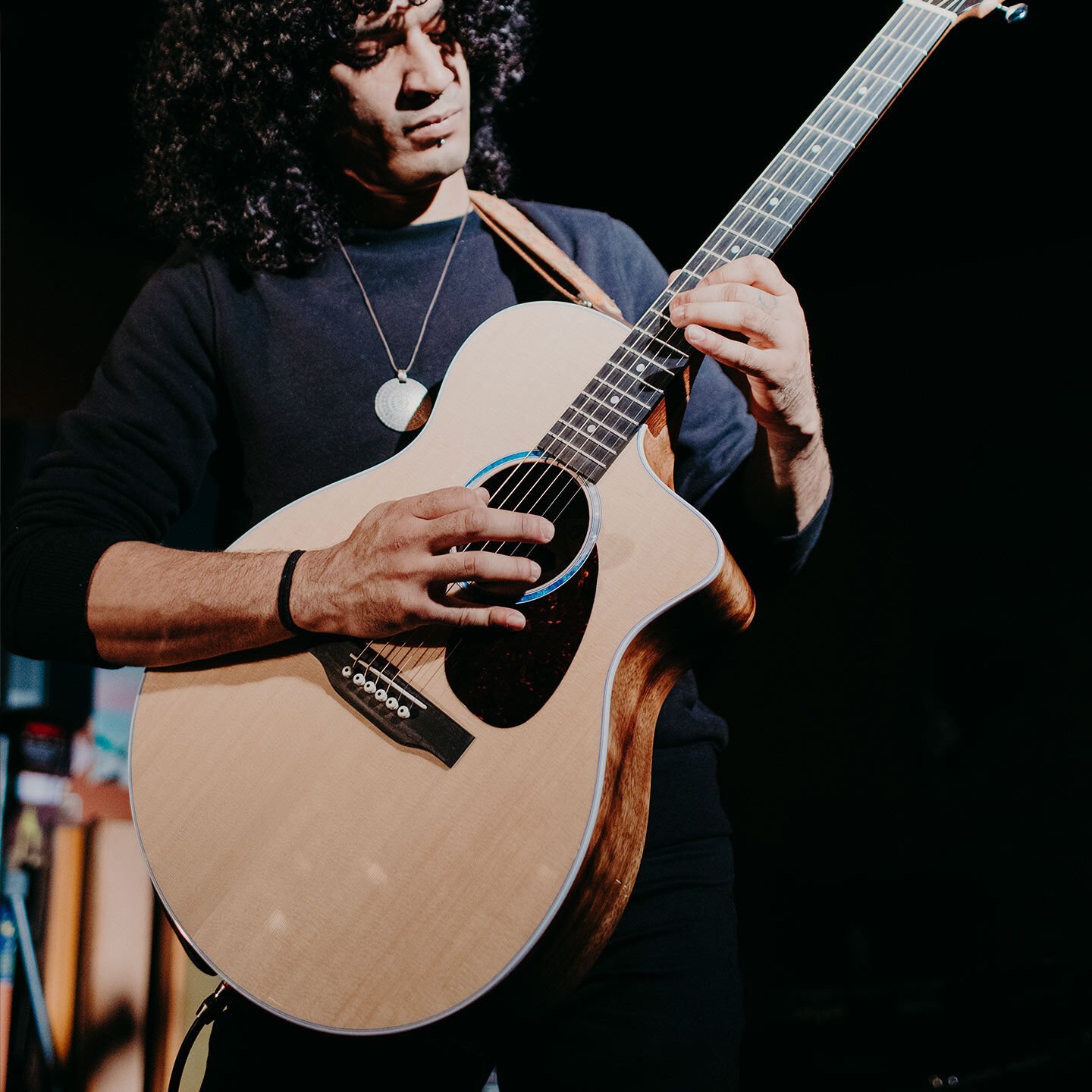 Person playing plugged in on stage or in studio Person playing plugged in on stage or in studio