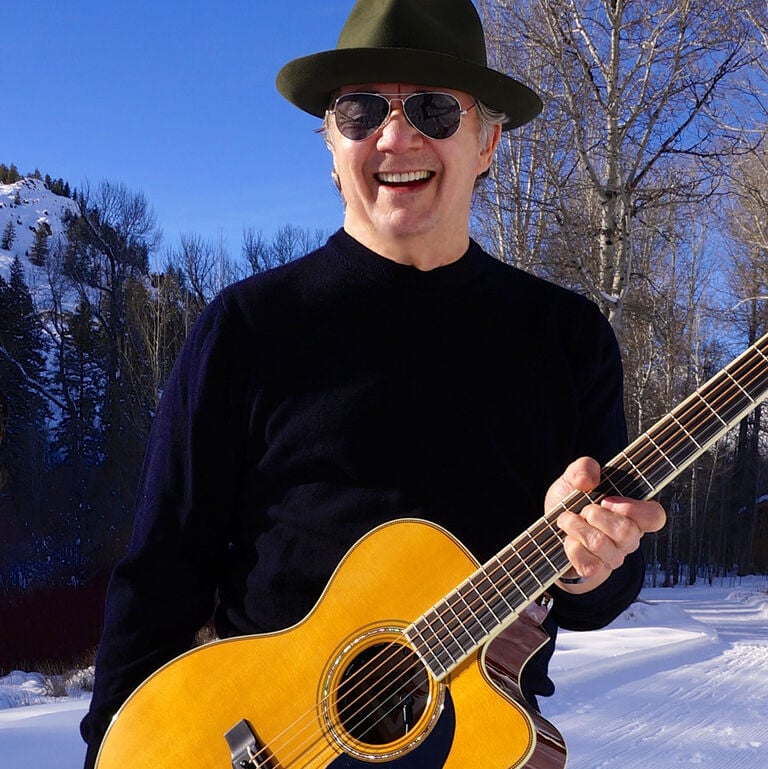 What is the first song you learned on the guitar and why?