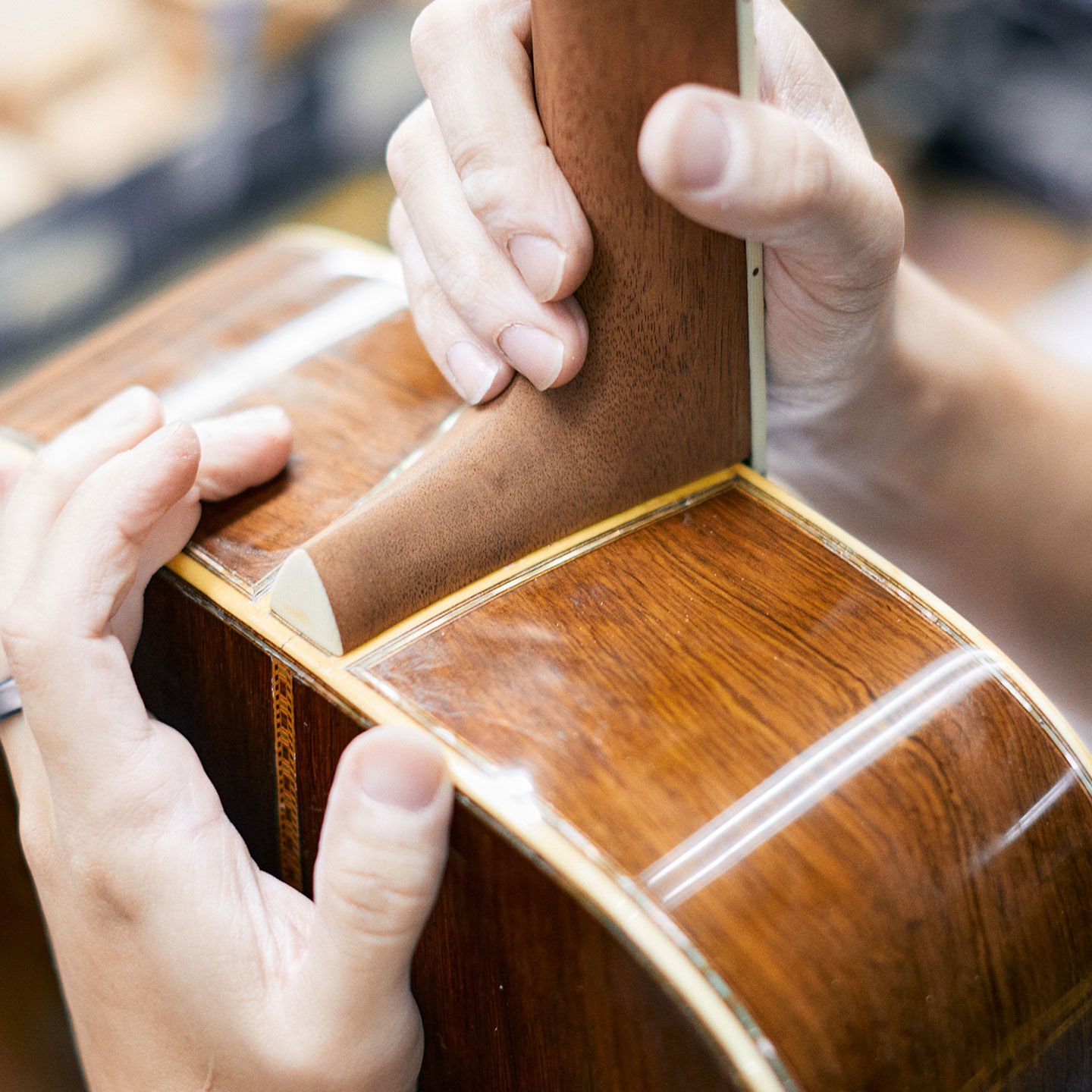 Close up of fitting a guitar neck on to a guitar body