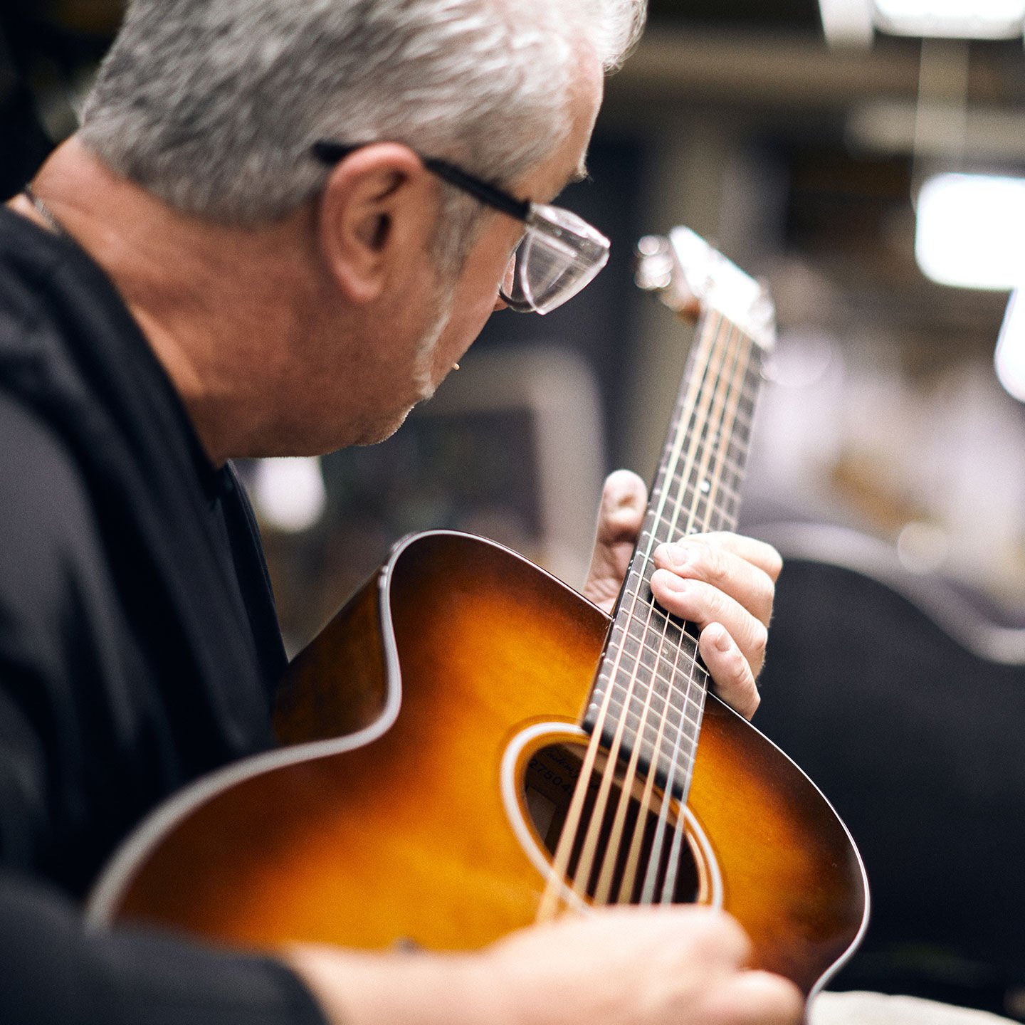 Person playing guitar