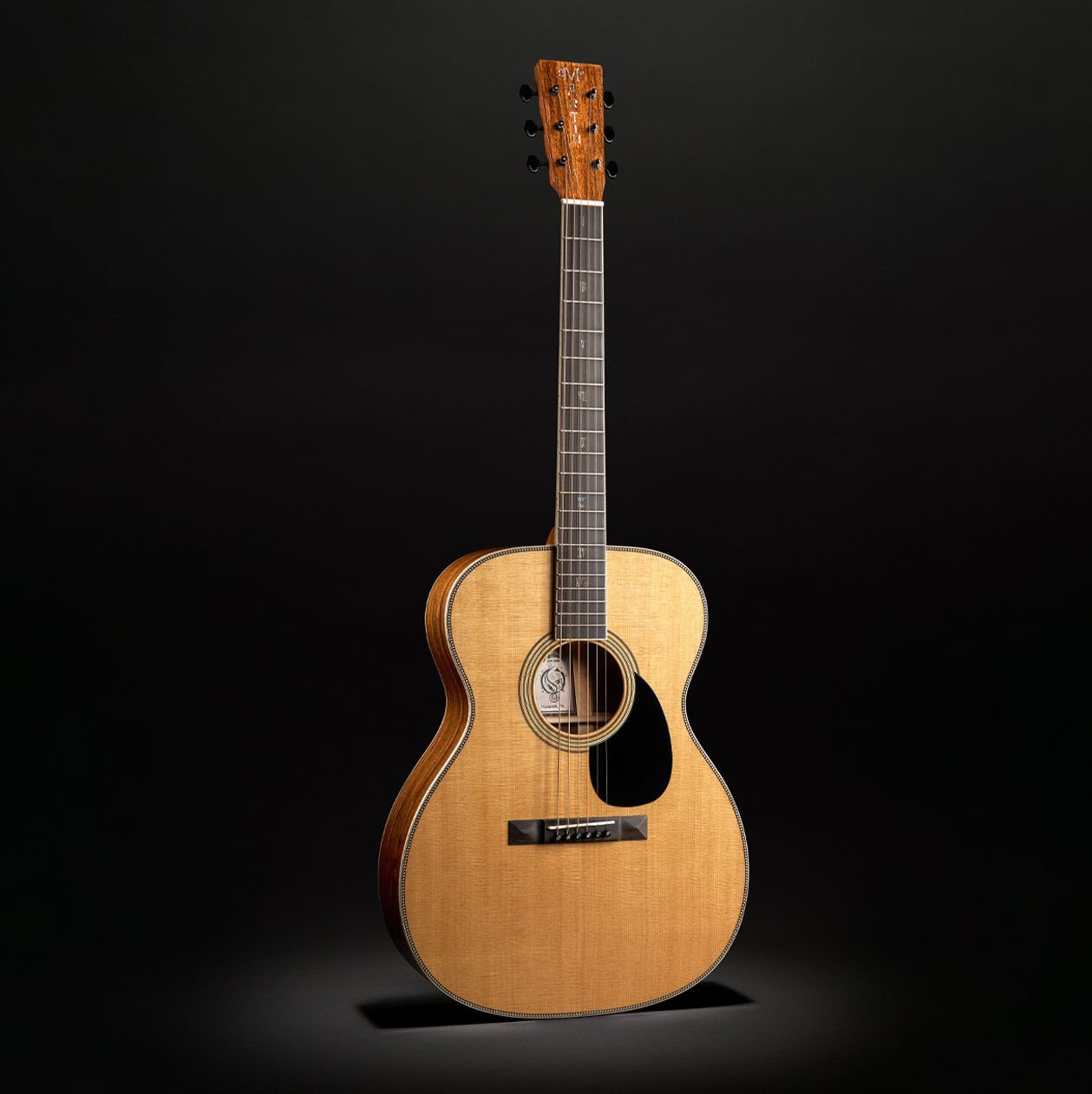 The OM Mikael Akerfeldt acoustic guitar on black background