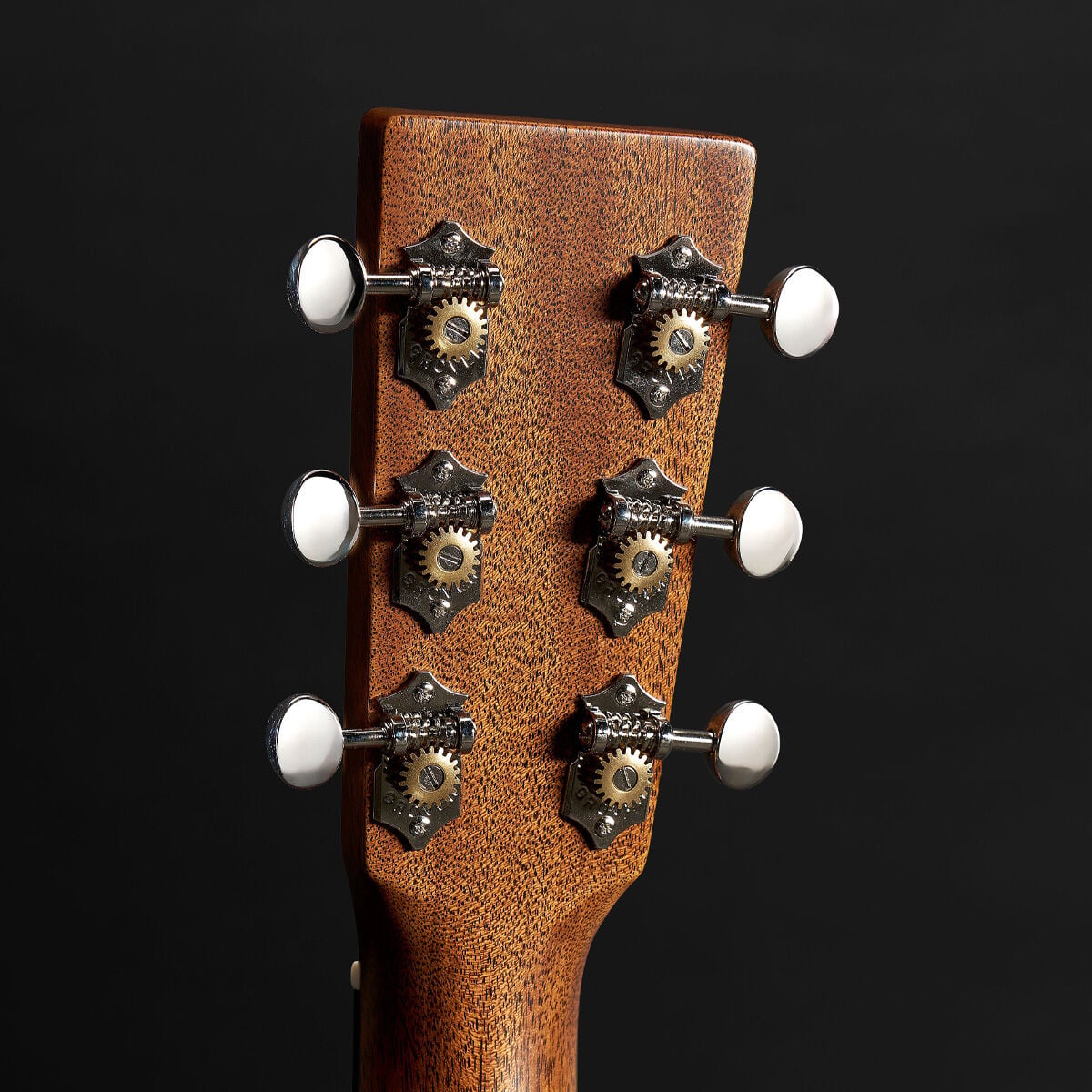 Behind the headstock of the 00-18