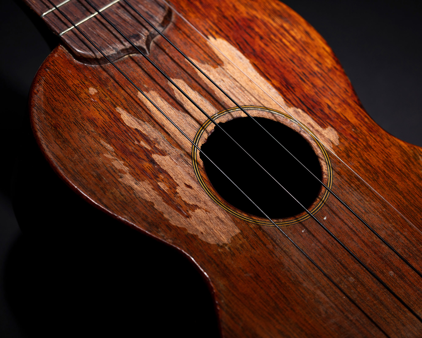 Tiny Tim's 1930 Martin Soprano Ukulele. The photo is of it's worn top.