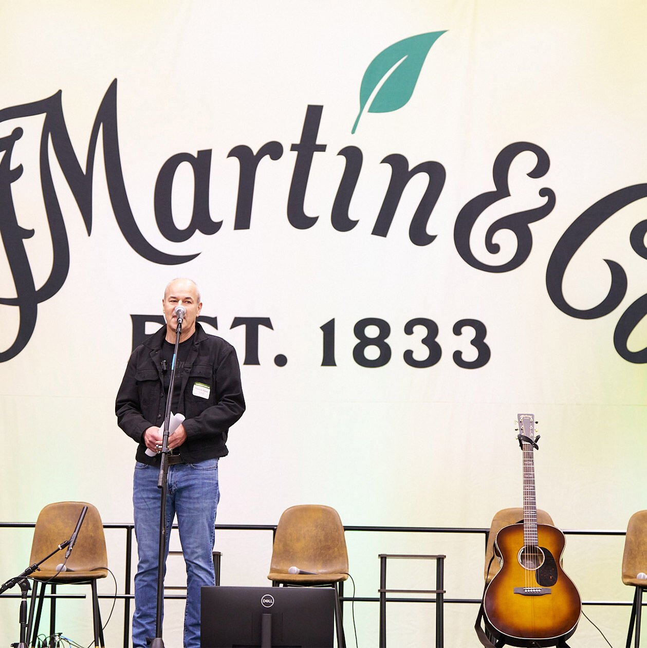 Single person standing up at the panel for the Martin Sustainability Summit