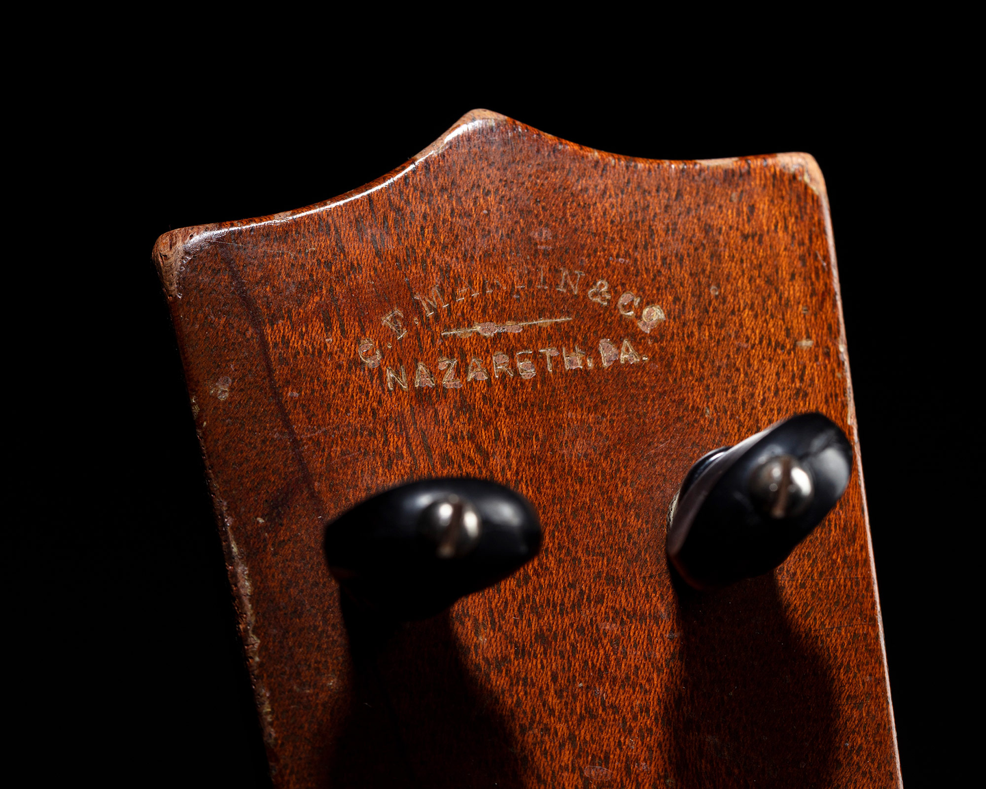 Back of Tiny Tim's ukulele's headstock, bearing the C.F. Martin & Co insignia