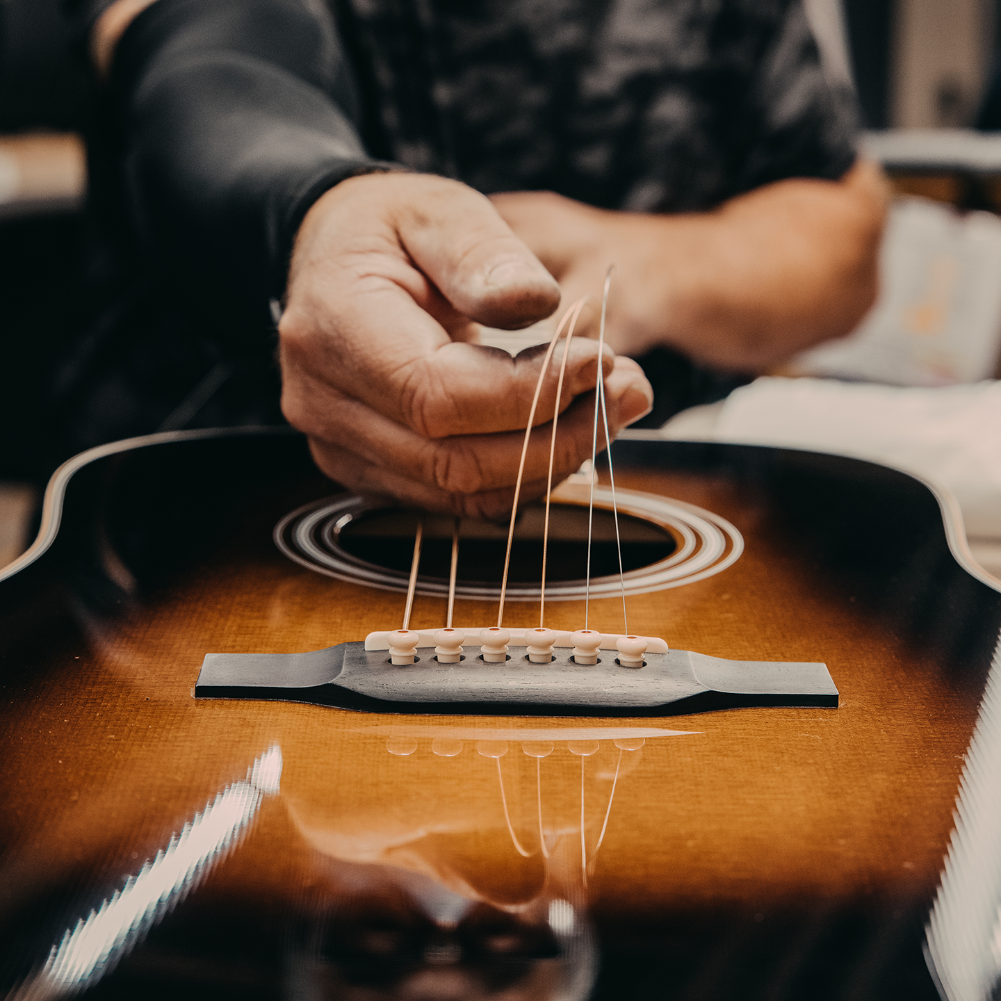 Stringing a guitar Stringing a guitar