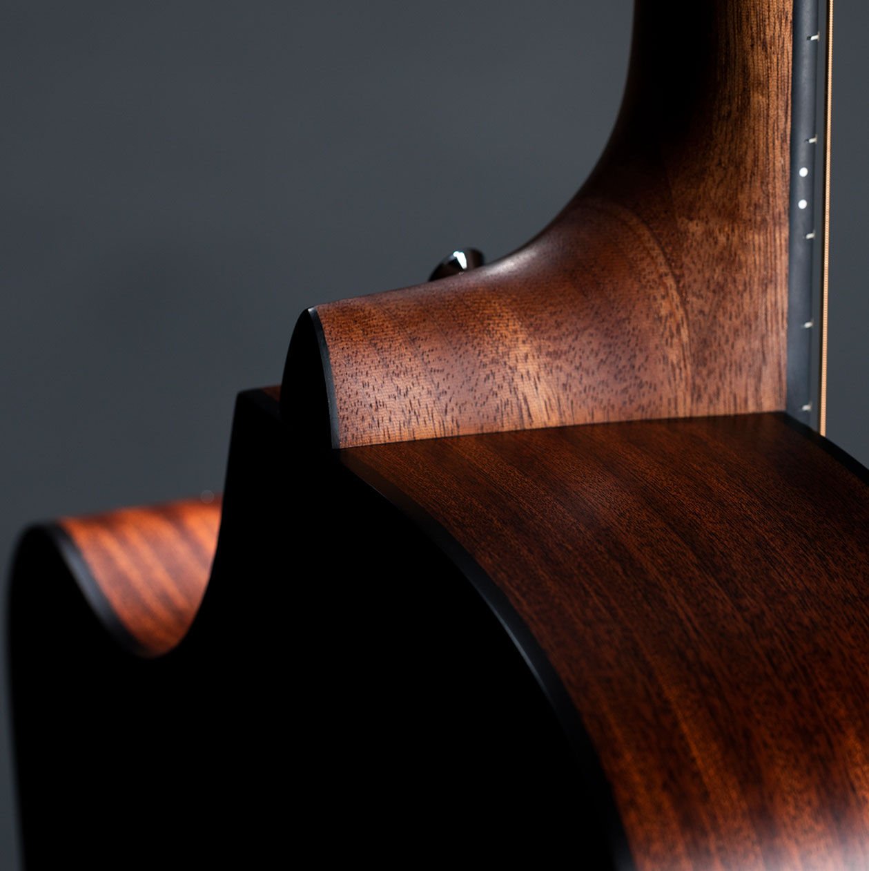 Close up of back of cutaway guitar