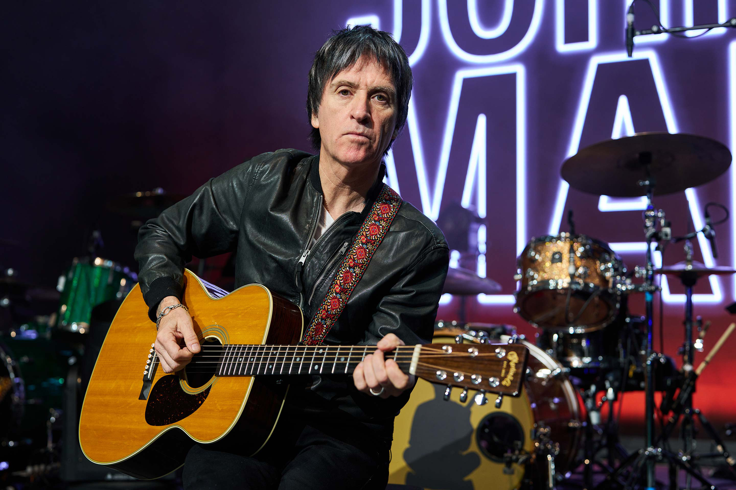Johnny Marr playing his guitar on stage