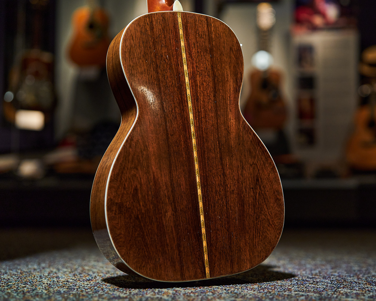 Photo of the back of an acoustic guitar