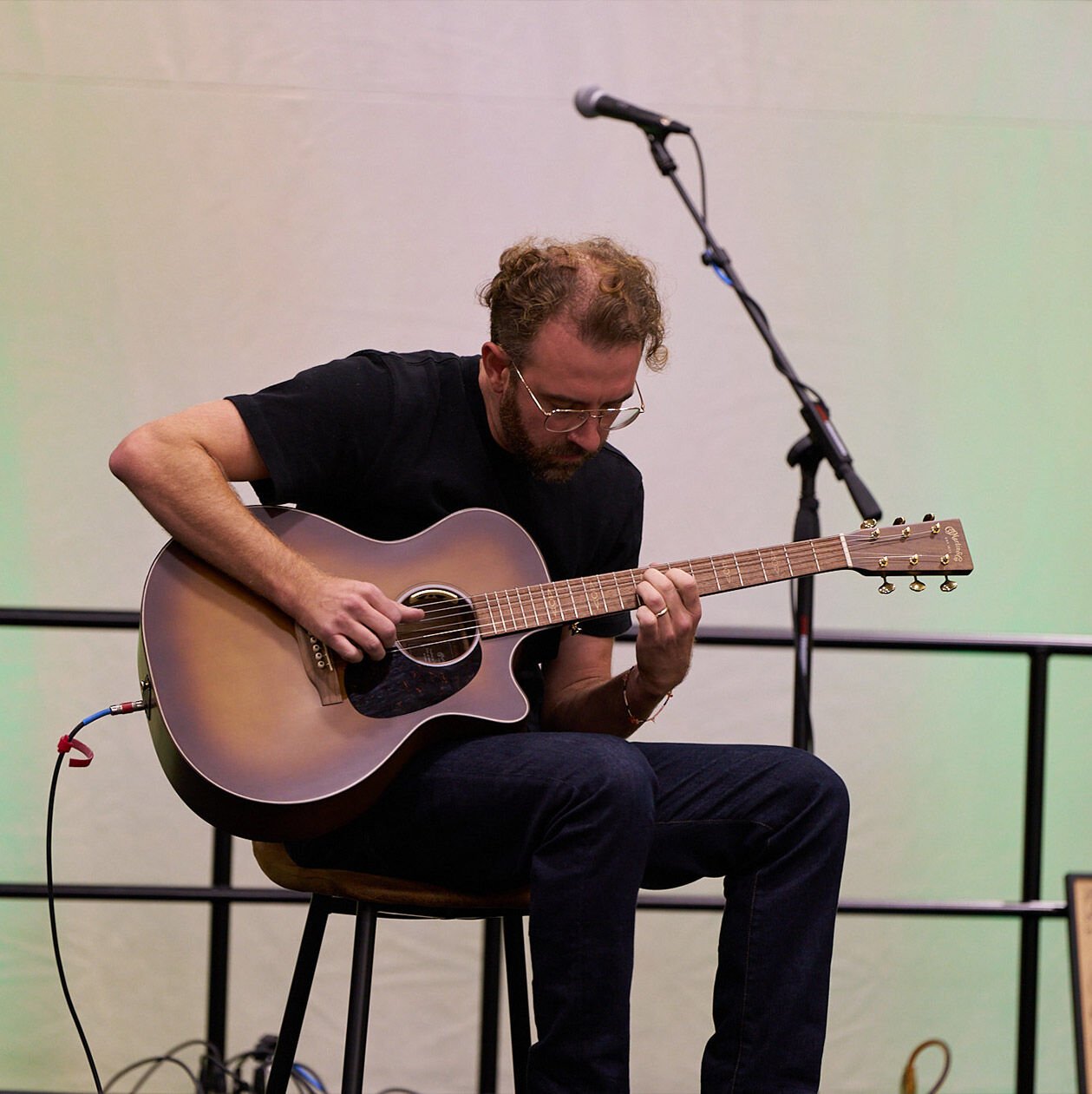Person playing the guitar at Martin Sustainability Summit