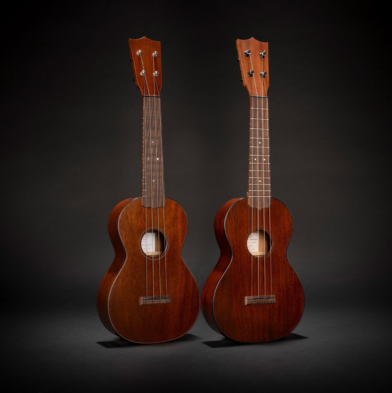 Both Martin Centennial ukuleles