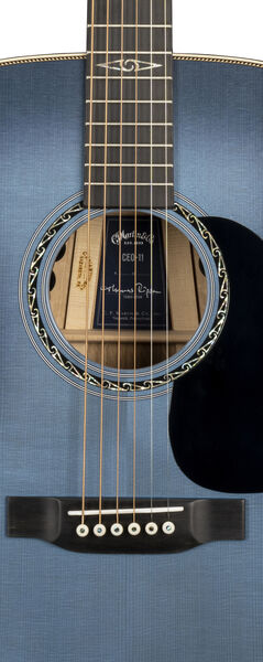 Rosette and bridge closeup of Martin CEO-11, showing custom rosette and bold half-herringbone top inlay