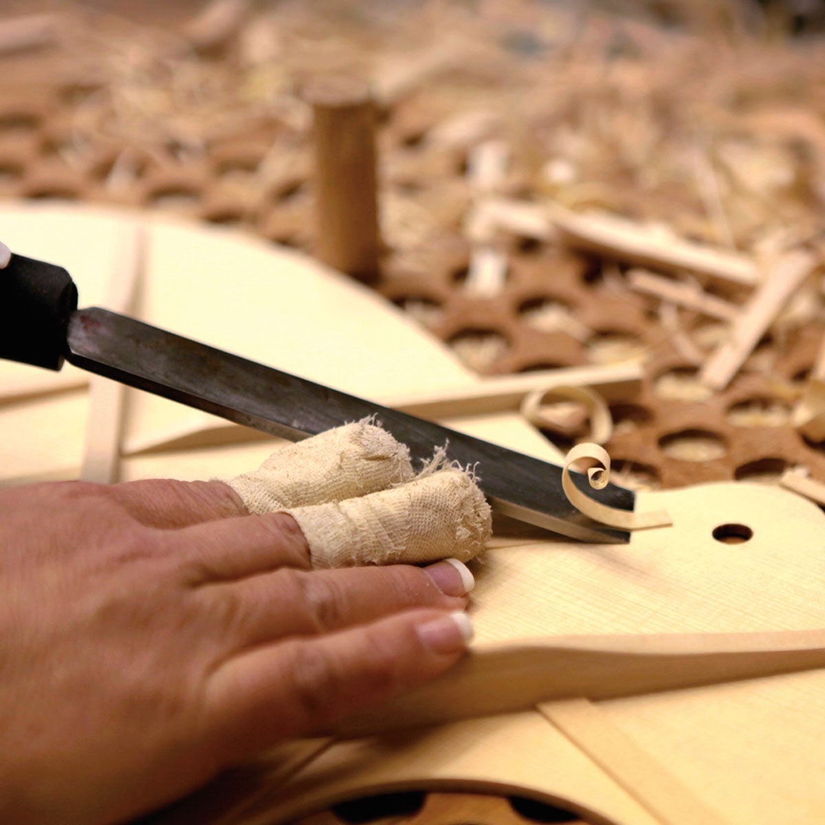 A person cutting bracing