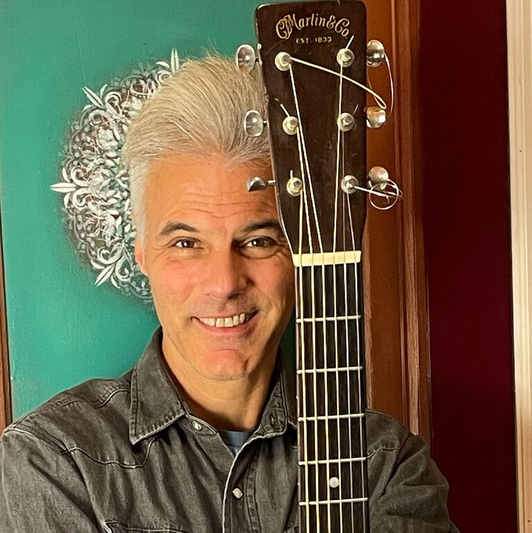 What tip would you give a new player about practicing guitar? 
