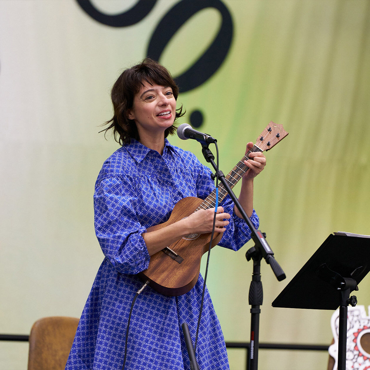 Woman playing a Martin ukulele