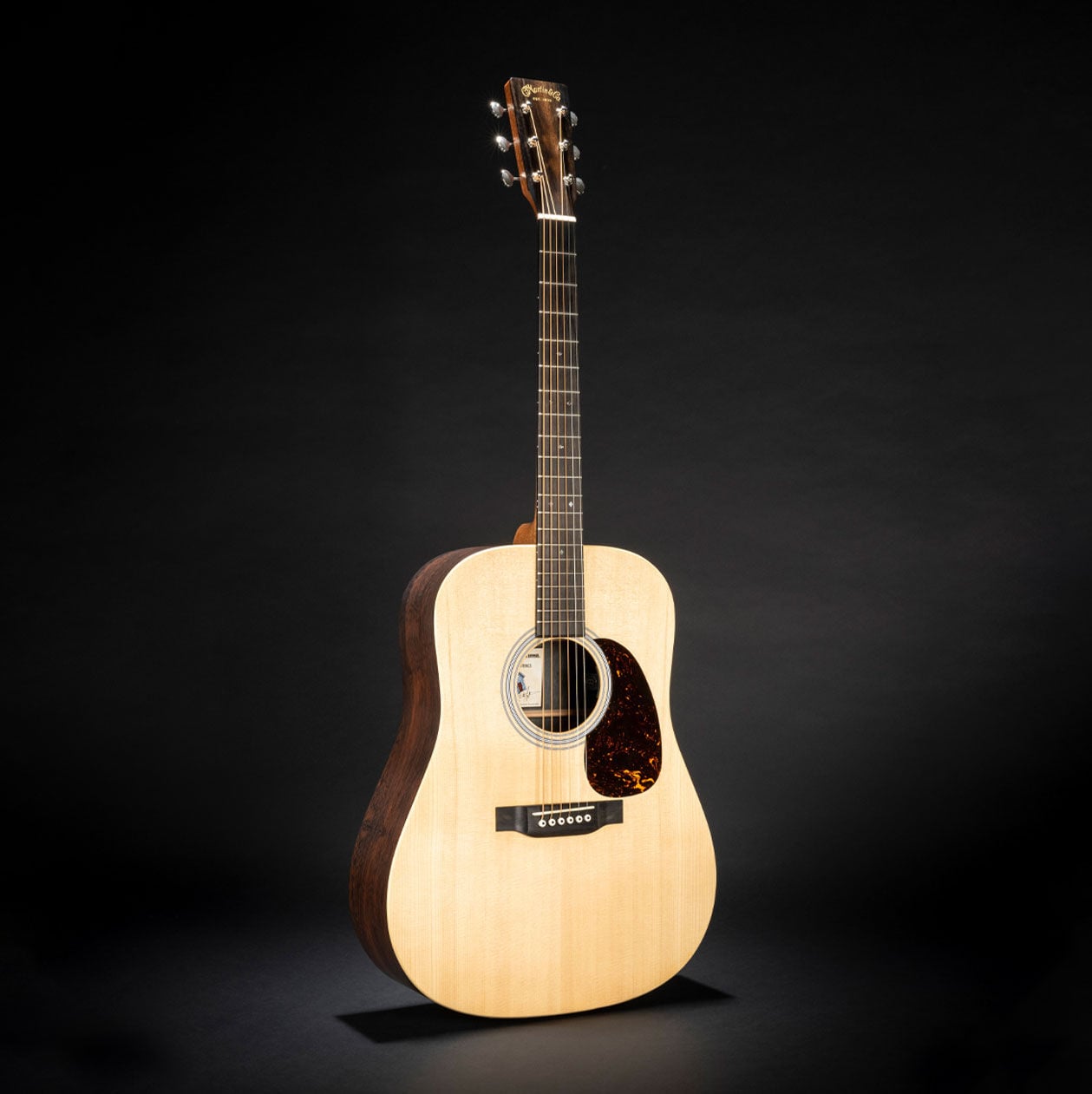 Photo of the D-X2E Billy Strings acoustic guitar at a slight angle
