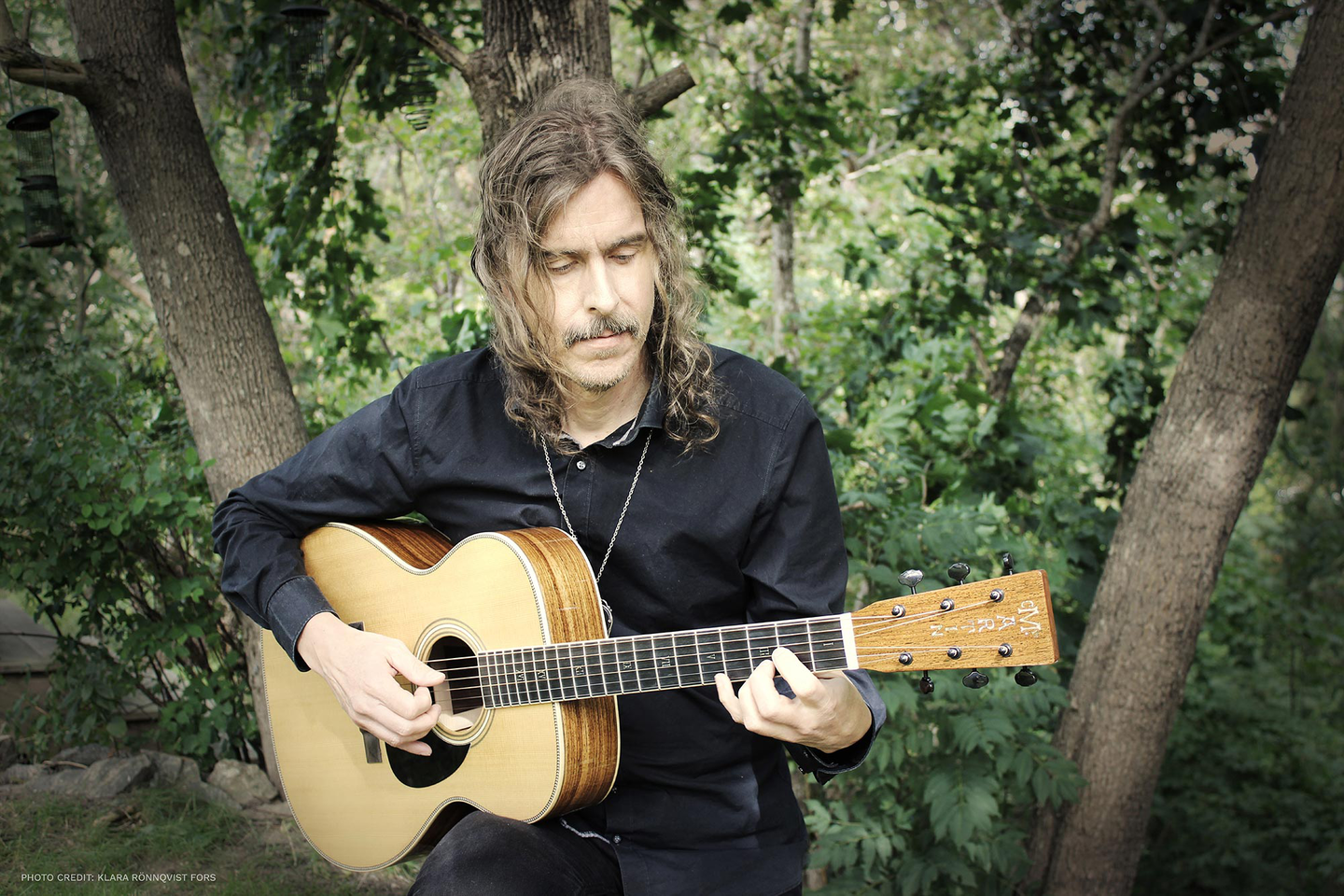 Mikael Akerfeldt playing his guitar